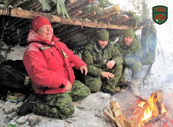 Sharing a laugh in an emergency shelter are, from left, Master Corporal Yvonne Sutherland, Sergeant Chris Brad, and Sapper Clayton Miller. Photo Sgt. Peter Moon