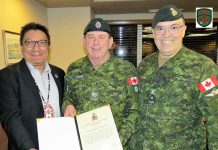 Canadian Army Commendations for Preventing Indigenous Youth Suicides Master Warrant Officer Barry Borton, centre, receives his commendation from Grand Chief Alvin Fiddler and Brigadier-General Jocelyn Paul.