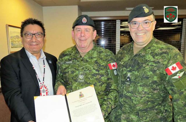 Master Warrant Officer Barry Borton, centre, receives his commendation from Grand Chief Alvin Fiddler and Brigadier-General Jocelyn Paul.