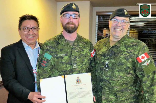 Major Charles Ohlke, centre, receives his commendation from Grand Chief Alvin Fiddler, left, and Brigadier-General Jocelyn Paul.
