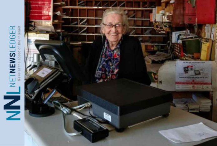 91-year-old Eileen O’Krafka, Canada’s oldest Postmaster, sitting at the desk of the store she has been a fixture in since 1969 in Rostock Ontario. A broad range of historic advertising from Eileen, some of it dating back to the original owner of her building, is now being offered for sale through Miller & Miller Auctions Ltd., of nearby New Hamburg.