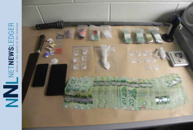 RCMP Manitoba image of weapons, drugs and money seized in The Pas