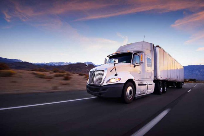 Semi Truck on highway at sunset