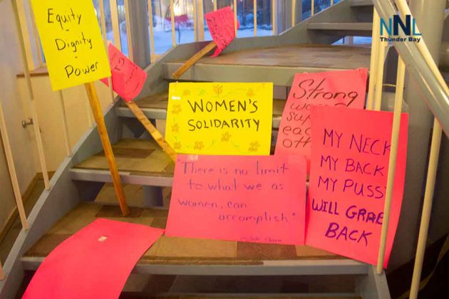 Signs of the times at International Women's Day at OPSEU