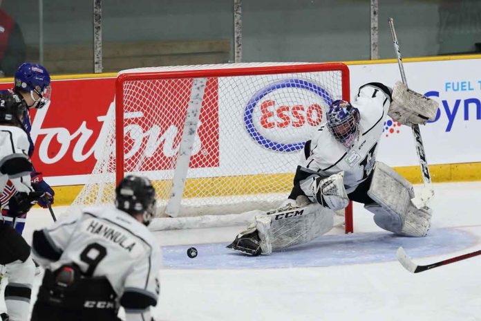 Kings goalie Jordan Smith is unable to get the right pad over in time as Calgary’s Carter Benoit (18) gets the Buffaloes on the scoreboard first at 4:14 of the first period.