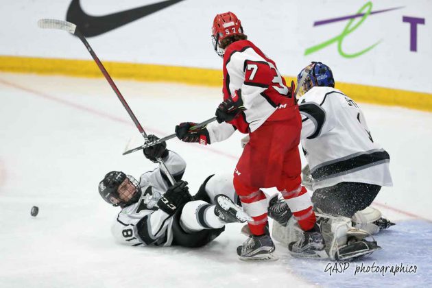 MacKenzie Sedgwick loses his footing against Toronto’s Elias Cohen following a save and rebound by the Kings Jordan Smith