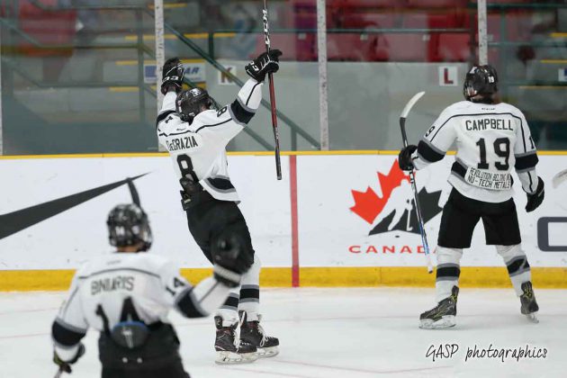 Kings Nicholas DeGrazia heads over to congratulate Nikolas Campbell on his 1st period goal.