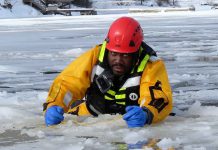 OPP ARE CONTINUING THE SEARCH FOR A 9-YEAR-OLD BOY IN LAKE ERIE NEAR NANTICOKE Sergeant Eric Scott hauls himself out of broken ice during ice rescue training.