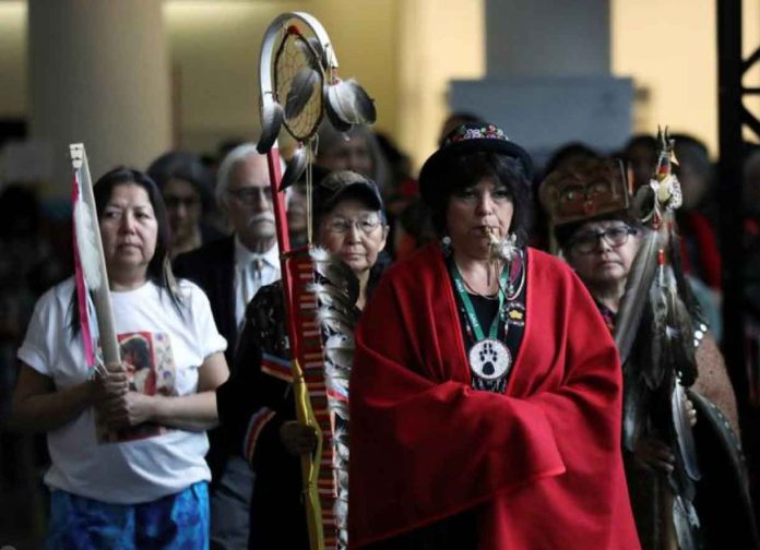 Women march in during the closing ceremony of the National Inquiry into Missing and Murdered Indigenous Women and Girls in Gatineau, Quebec, Canada, June 3, 2019. REUTERS/Chris Wattie