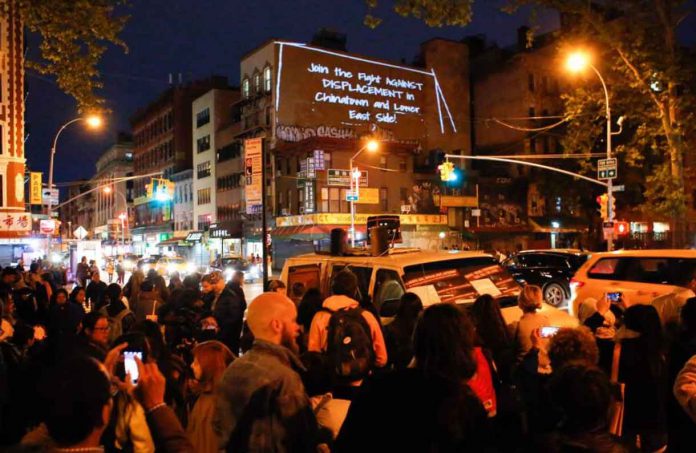 Activists and participants take part in a tenants rights action in Chinatown, New York City, on May 12, 2017. Handout photo courtesy of the Illuminator