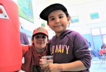 Canadian Rangers Assisting Evacuees in Six Ontario Host Communities Ranger Carla Slobozian helps Pikangikum evacuee Patience Turtle, five, to get a drink at Pelican Falls First Nations School, near Sioux Lookout