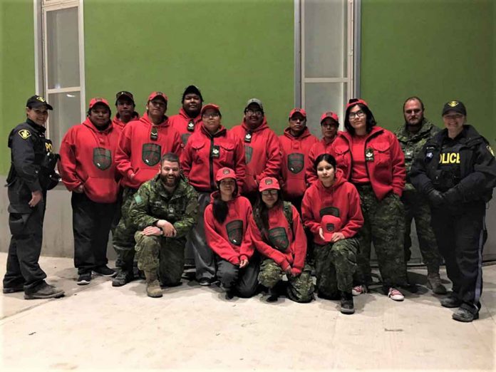 Some of the Canadian Rangers and Ontario Provincial Police officers assisting the evacuation of Pikangikum.