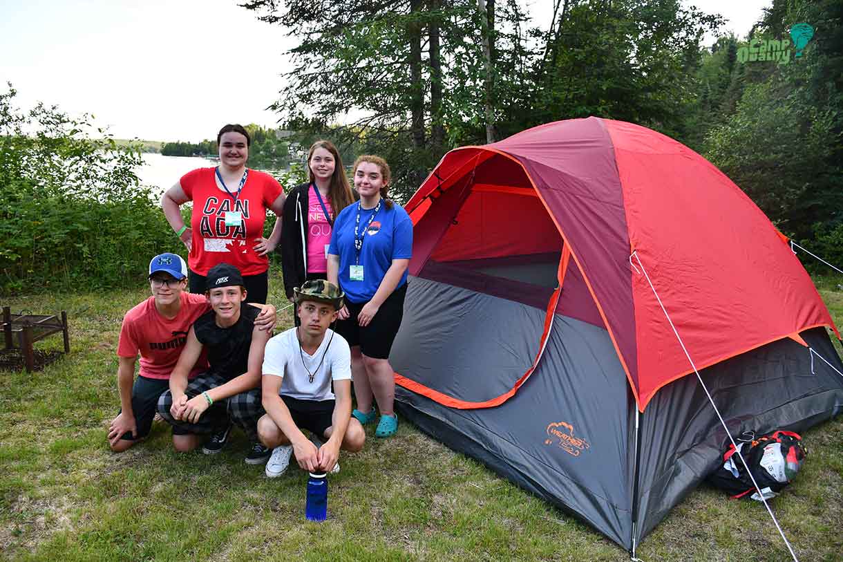 Some of our teen campers showing off the tent they put their blood, sweat and tears into. (Back, from left: Campers Alyx, Katelyn and Isabella. Front, from left: Noah, Zeke and Connor.)