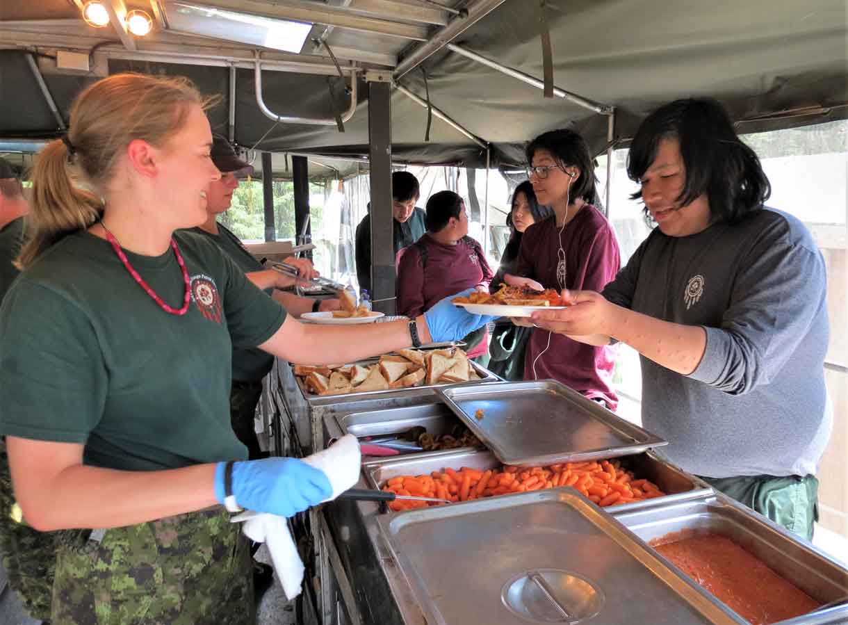 Camp Loon's popular food is prepared by military cooks in two mobile field kitchens.