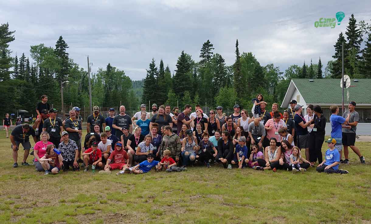 Camp Quality volunteers and campers pose with the Thunder Bay Police for a group photo after our epic soccer game.