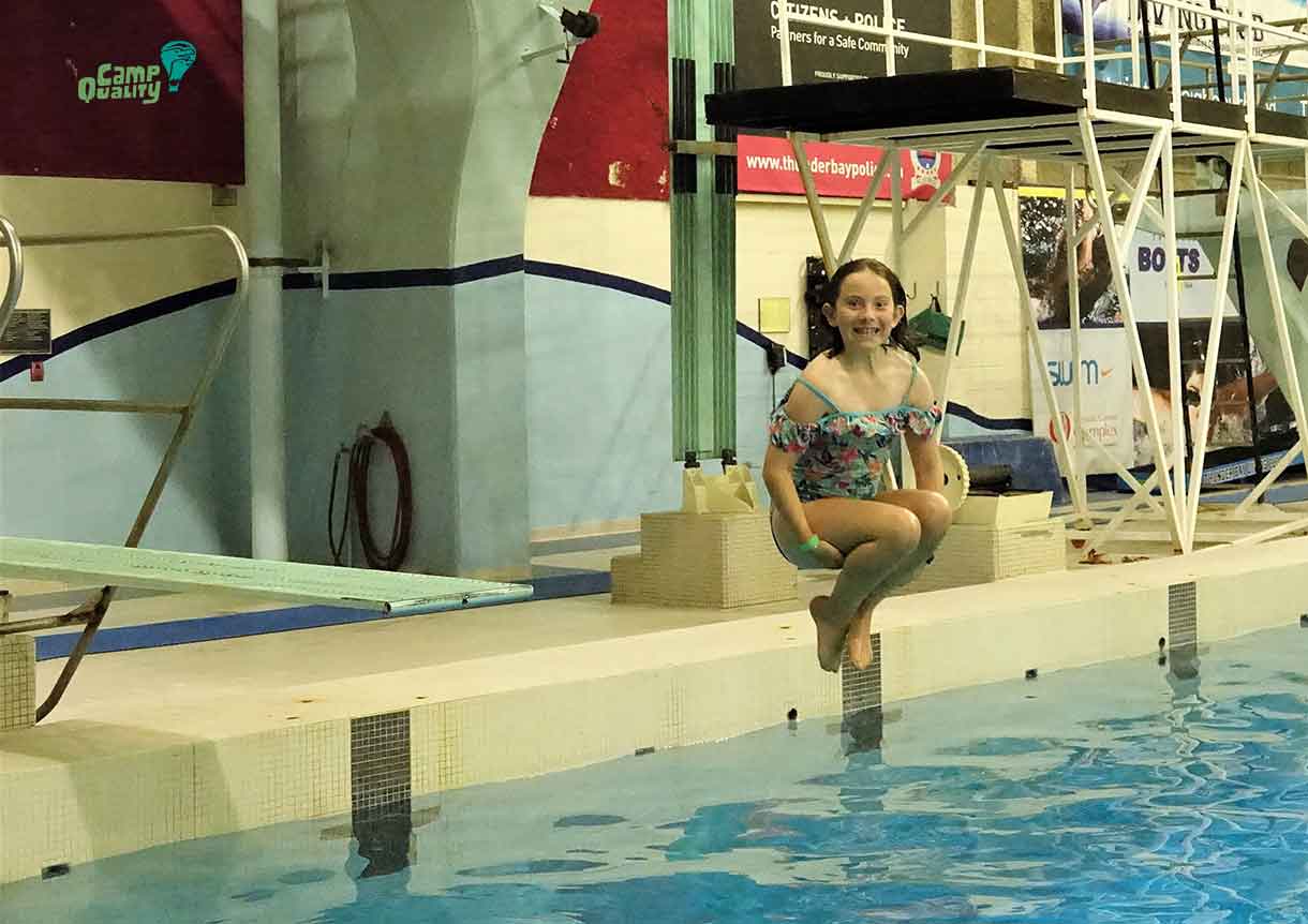 Camper Lilly showing off her skills on the diving board.