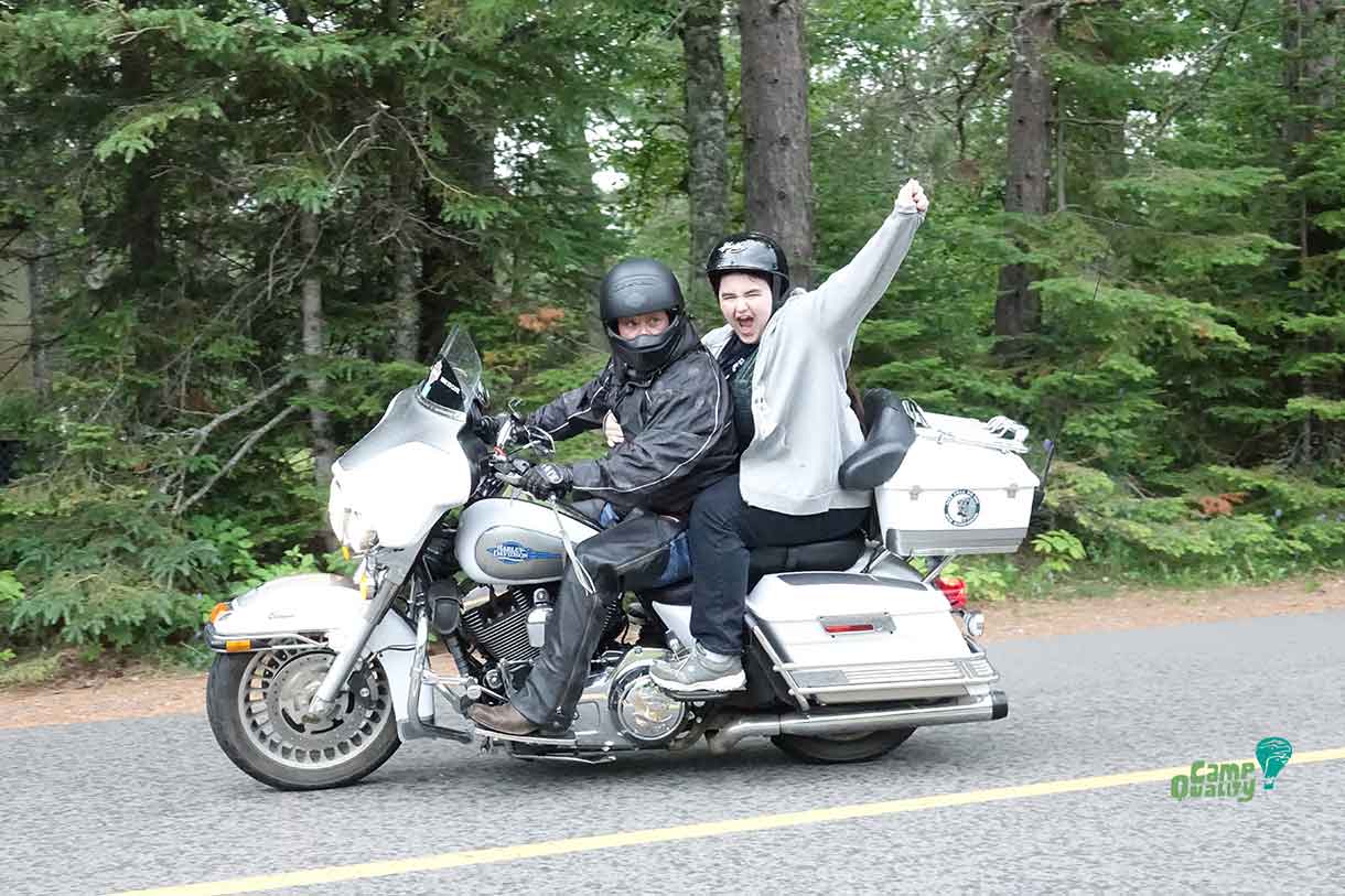 Camper Alyx on the back of a really cool motorcycle – looks like she’s having a great time!