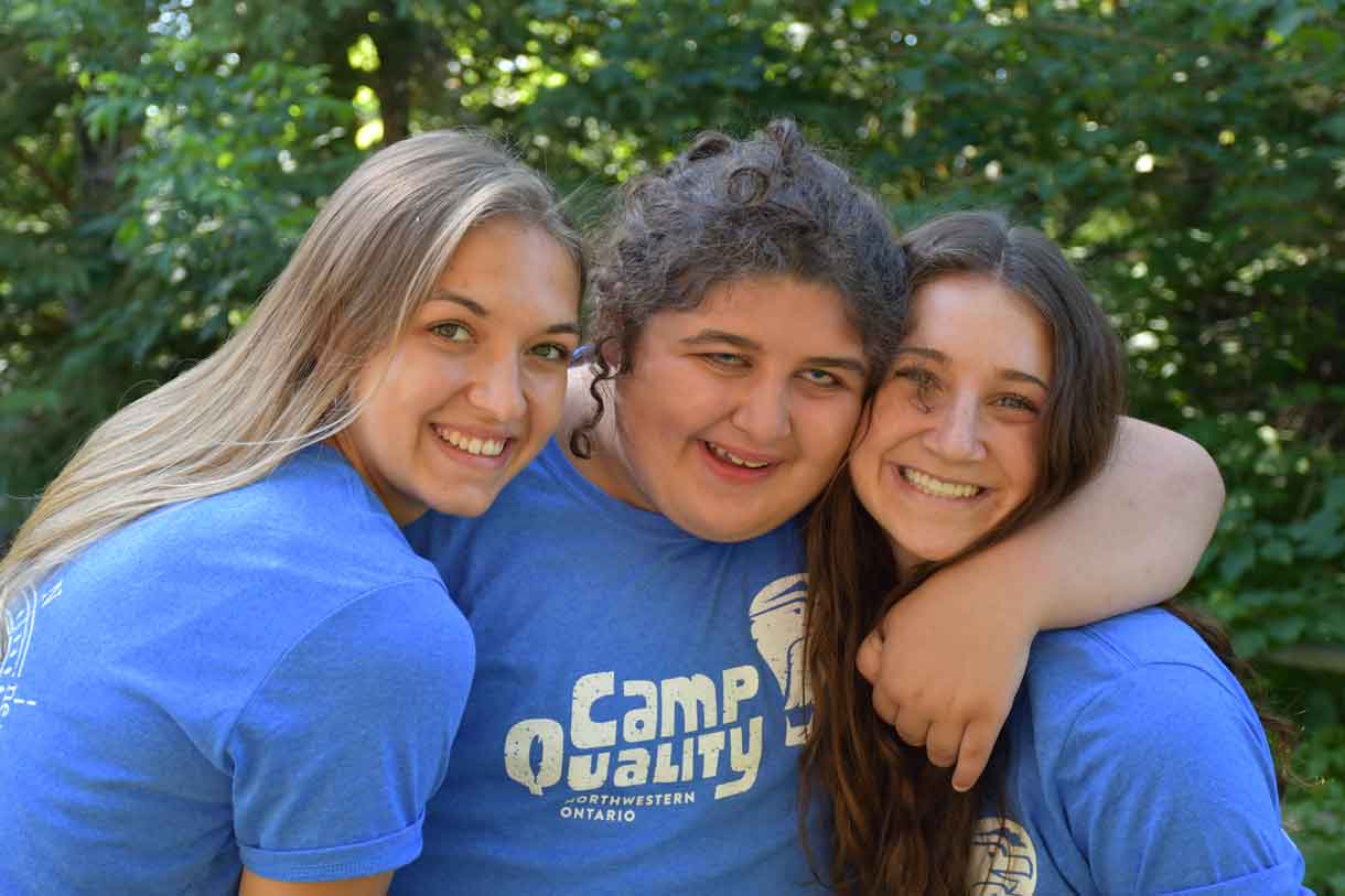 Camper Danica (middle) with Companions Paige (left) and Jacqueline, sporting their blue camp T-shirts