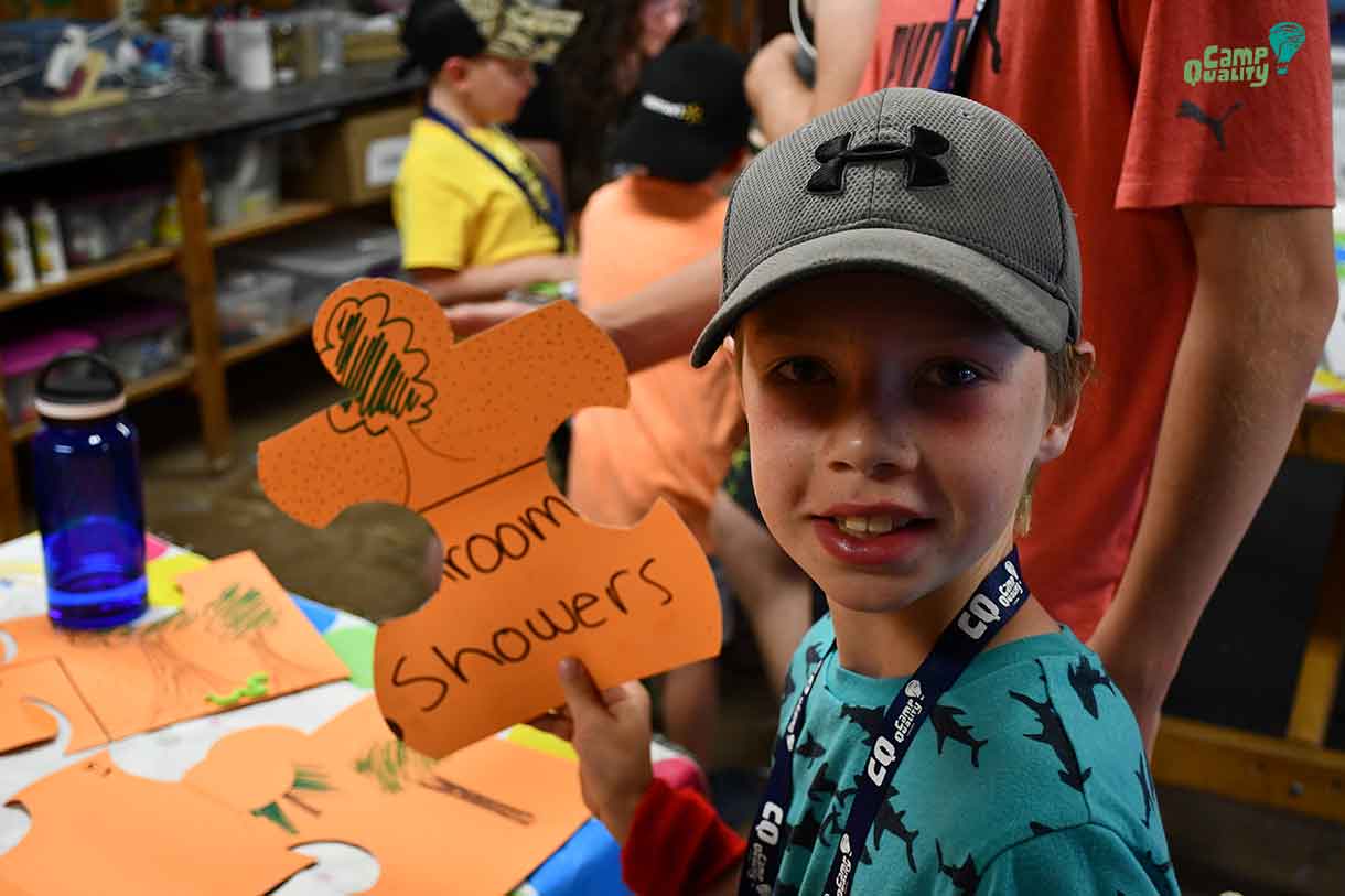 Camper Ryder shows off a piece of the Treasure Map Puzzle