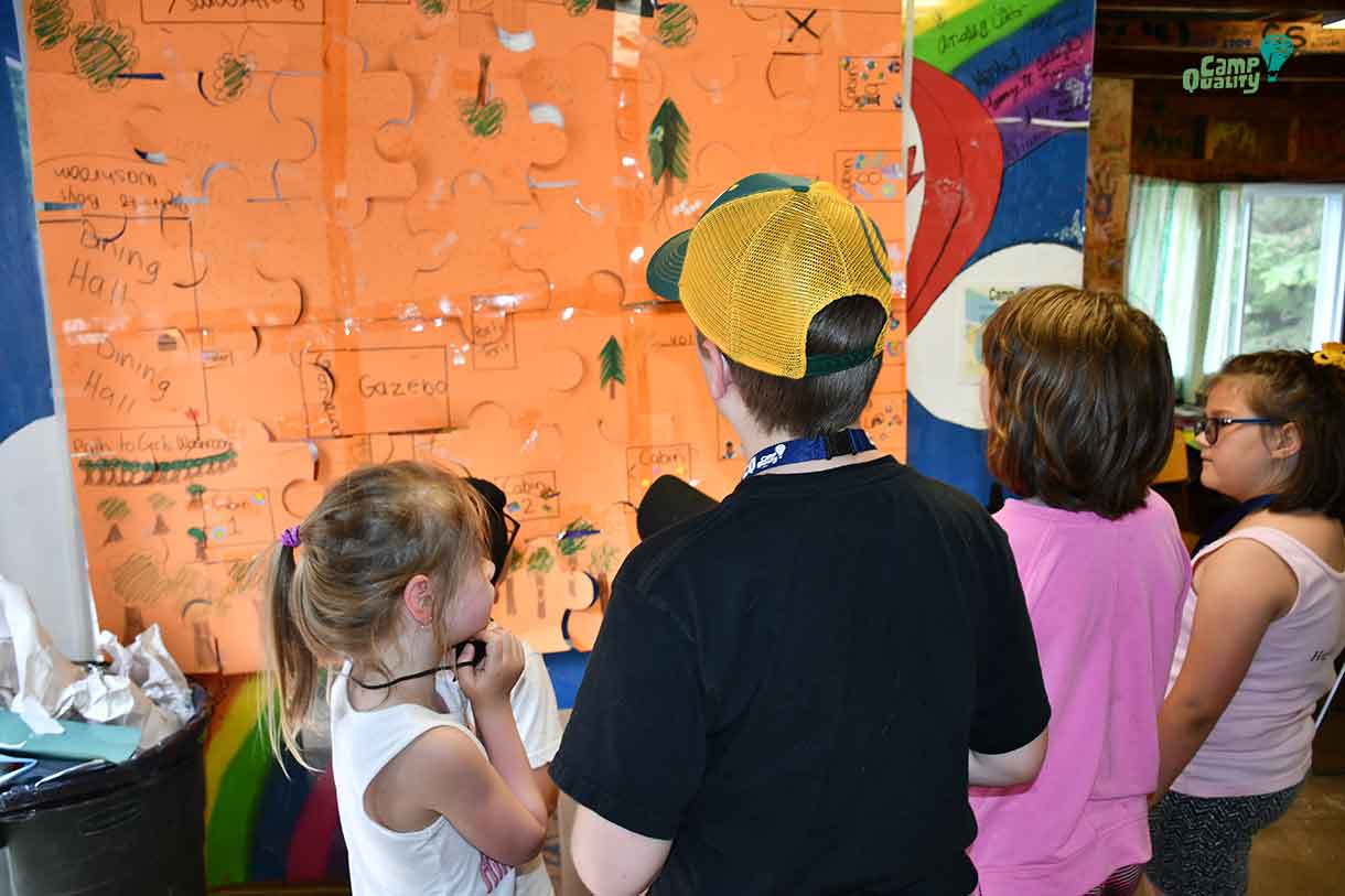 From left, campers Ally, Gryphon, Kassi and Sammy look at the completed treasure map!