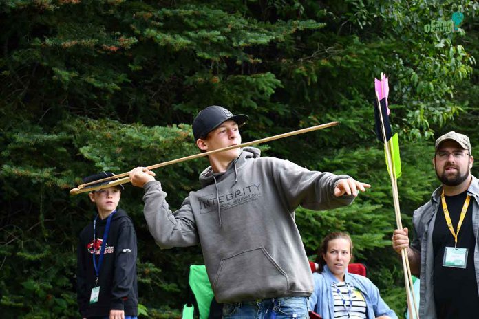 Camper Zeke winding up for what would be his winning shot – all the way into the lake. Good arm, Zeke!