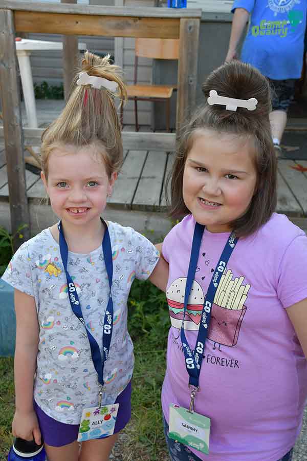 Campers Ally (left) and Sammy showing off their hair for tonight’s themed dinner – Flintstone hair! Very creative, girls!