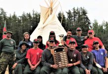 Mishkeegogamang Junior Rangers Top Patrol in Ontario Some of the Mishkeegogamang Junior Canadian Ranger patrol at Camp Loon with the award for the province's best Junior Ranger patrol;.