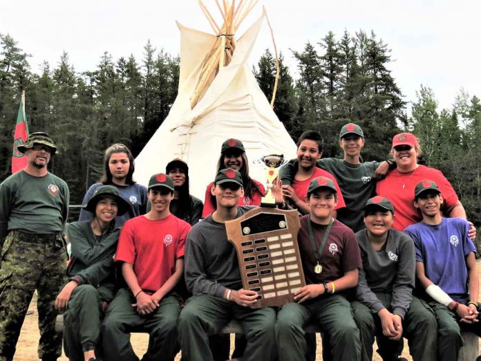 Some of the Mishkeegogamang Junior Canadian Ranger patrol at Camp Loon with the award for the province's best Junior Ranger patrol;.