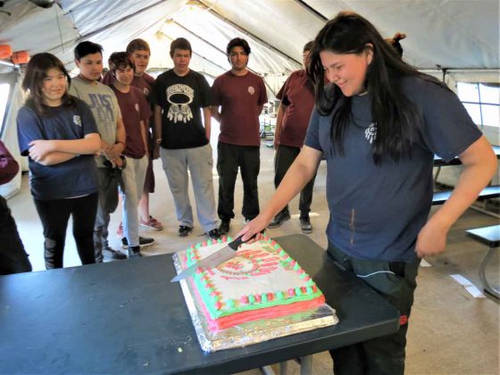 Junior Canadian Ranger Sophaiah Koostachin of Fort Severn cuts a cake made for her 14th birthday. All Junior Ranger birthdays at the camp were celebrated. Photo credit Sergeant Peter Moon, Canadian Rangers