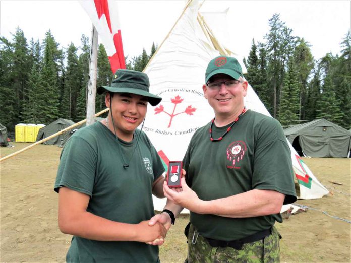 Junior Canadian Ranger Daniel Bottle, left, receives the Order of St. George Medal from Lieutenant-Colonel Matthew Richardson, who commands the Canadian Rangers of Northern Ontario. Photo by Sgt Peter Moon Canadian Rangers