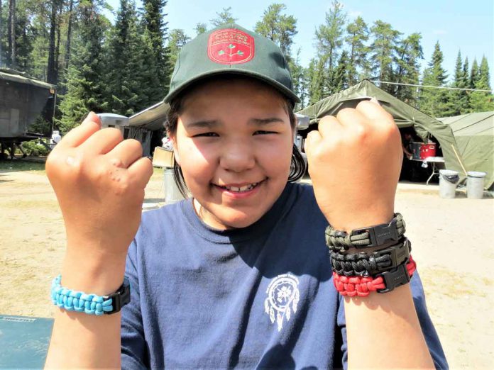 Junior Canadian Ranger Keiannna Scott, 12, of Fort Albany, shows off the bracelets she made at Camp Loon. credit Sergeant Peter Moon, Canadian Rangers