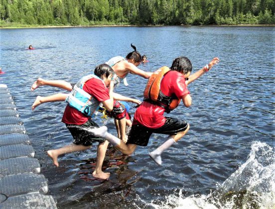 Junior Canadian Rangers take a leap into cooling water on a hot day at Camp Loon. Photo - Sgt Peter Moon Canadian Rangers