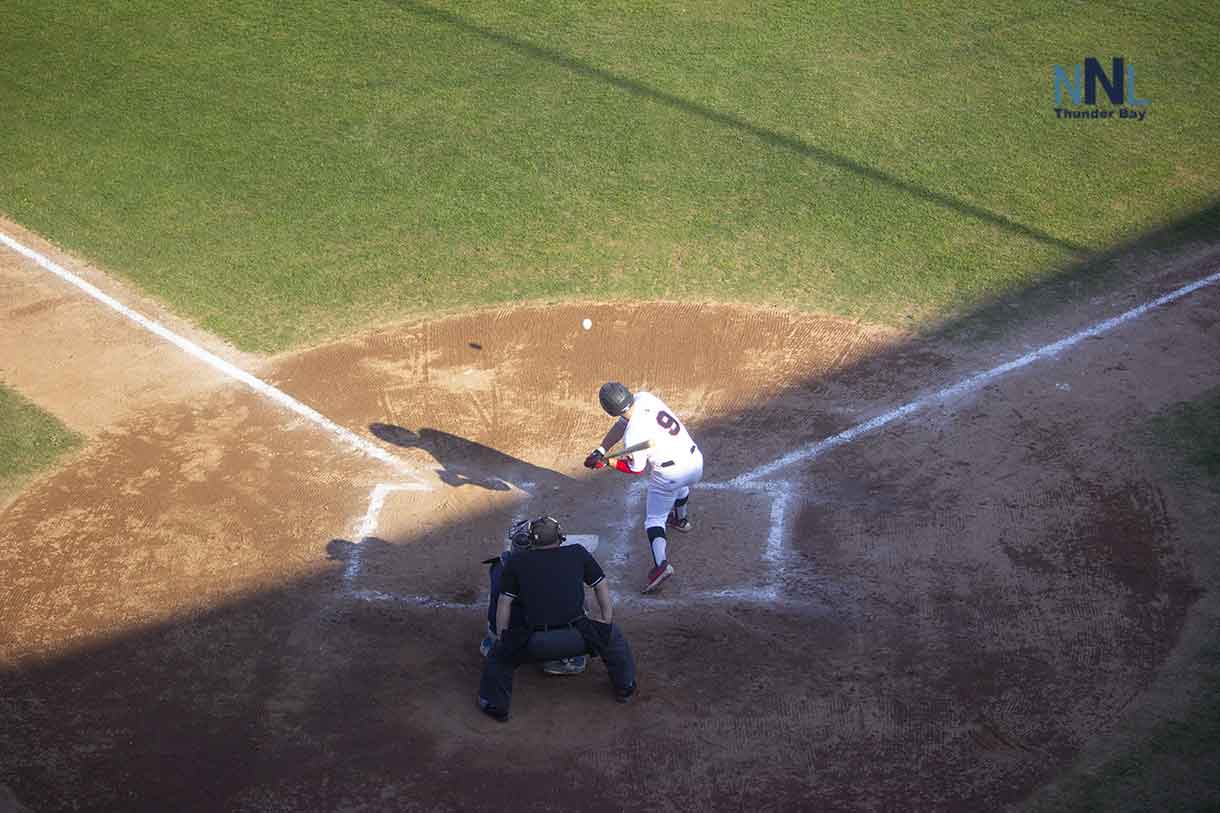 Ryne Edmonston belts the ball for a double to drive home the winning run