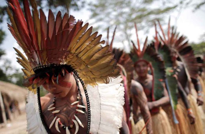 Indigenous people from the Shanenawa tribe dance during a festival to celebrate nature and ask for an end to the burning of the Amazon, in the indigenous village of Morada Nova near Feijo, Acre State, Brazil, September 1, 2019. REUTERS/Ueslei Marcelino