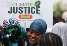 COP28: Can ‘carbon capture’ keep fossil fuels viable? A protester smiles during a demonstration for climate protection in Abuja, Nigeria September 20, 2019. REUTERS/Afolabi Sotunde