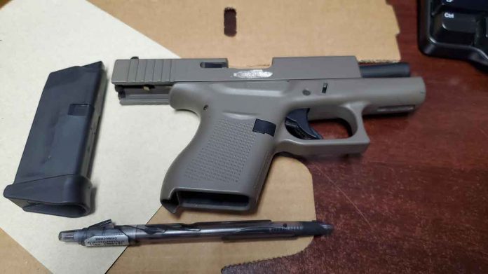 Police seized this handgun which was loaded from one of the suspects
