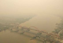 Indonesia shuts some schools as haze again clouds the skies An aerial view of Palembang city covered by smoke from the forest fire in South Sumatra province, Indonesia, October 14, 2019 in this photo taken by Antara Foto. Antara Foto/Nathan/via REUTERS