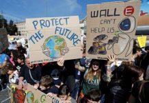 COP15 nature deal hailed as ‘major step’ for Indigenous Rights Students hold banners during a protest to demand action on climate change, in Piazza del Popolo, Rome, Italy April 19, 2019. REUTERS/Yara Nardi