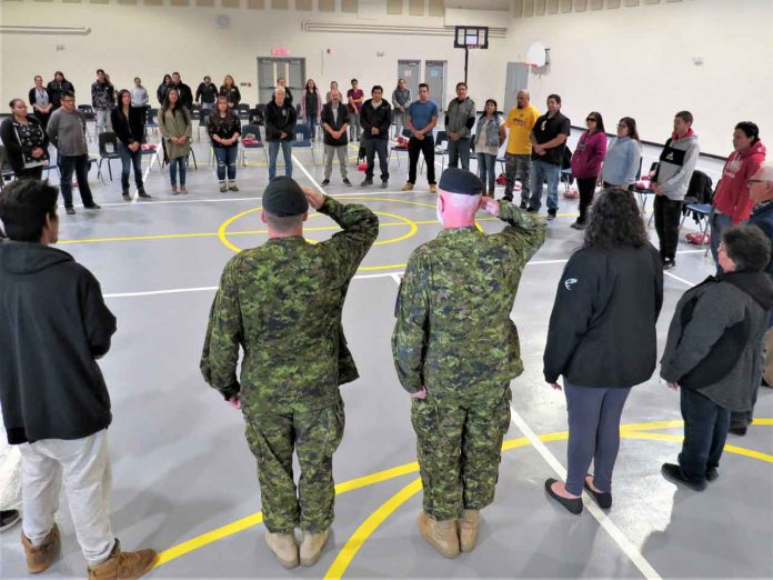 New Canadian Rangers form a circle during the swearing-in ceremony for the new patrol in Long Lake # 58 First Nation