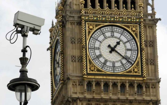 ARCHIVE PHOTO: A surveillance camera points towards Parliament Square, in front of the Big Ben Clock Tower in London October 18, 2010. REUTERS/Luke MacGregor