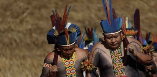 Indigenous people of Tapirape tribe, perform a greeting dance during a four-day pow wow in Piaracu village, in Xingu Indigenous Park, near Sao Jose do Xingu, Mato Grosso state, Brazil, January 14, 2020. REUTERS/Ricardo Moraes