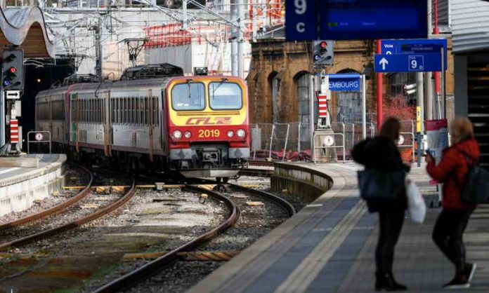 Passengers wait on a platform as a train arrives at Luxembourg railway station, February 29, 2020. REUTERS/Francois Lenoir