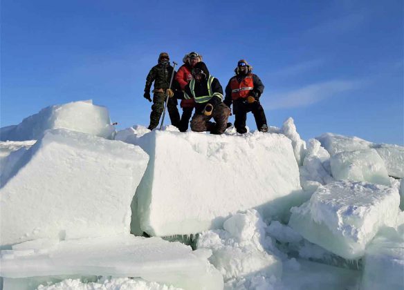 Canadian Rangers climb huge blocks of ice on the shore of James Bay. credit Lieutenant-Colonel Shane McArthur, Canadian Rangers