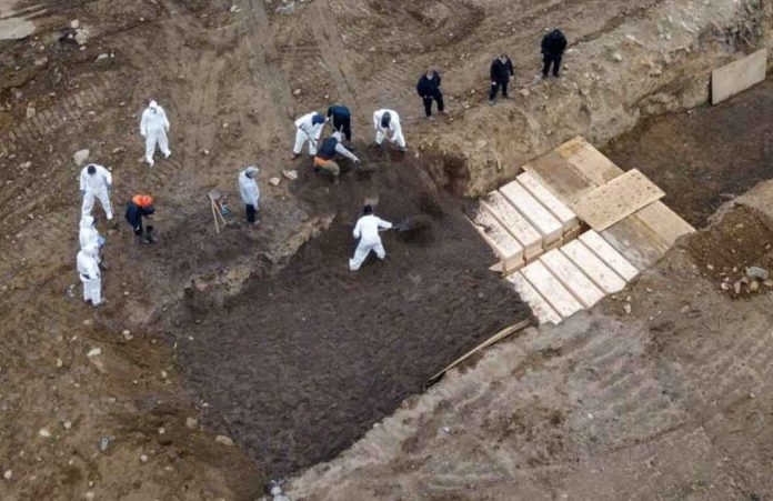 ARCHIVE PHOTO: Drone pictures show bodies being buried on New York's Hart Island where the department of corrections is dealing with more burials overall, amid the coronavirus disease (COVID-19) outbreak in New York City, U.S., April 9, 2020. REUTERS/Lucas Jackson