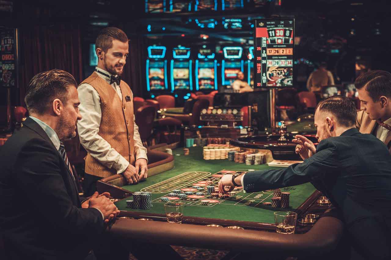 Upper class friends gambling in a casino.