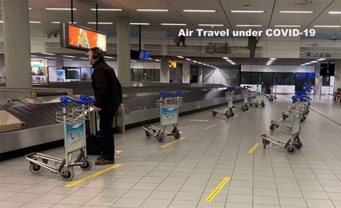 A man waits for his luggage at Schiphol Airport in Amsterdam, the Netherlands, May 15, 2020. Thomson Reuters Foundation /Umberto Bacchi