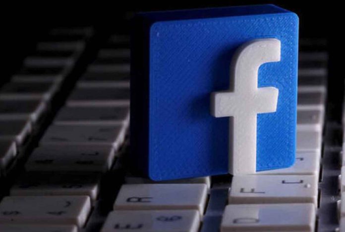 FILE PHOTO: A 3D-printed Facebook logo is seen placed on a keyboard in this illustration taken March 25, 2020. REUTERS/Dado Ruvic/Illustration/File Photo