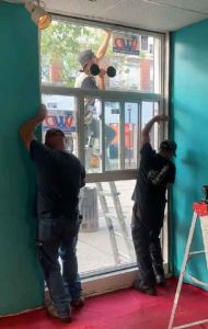 New Touchless Window at The Hub on Victoria Avenue East being installed