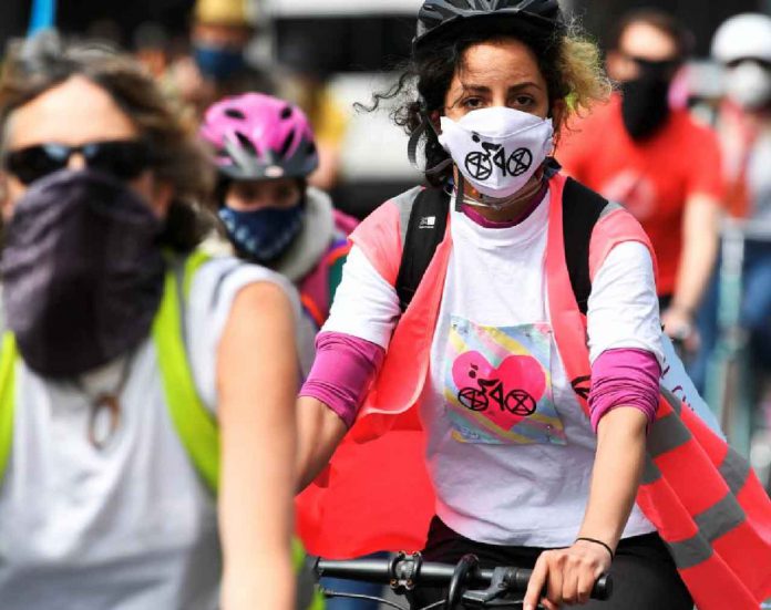 Members of Extinction Rebellion take part in a socially distanced bicycle ride to campaign for more cycling and cycle lanes and fewer vehicles on the roads, following the outbreak of the coronavirus disease (COVID-19), London, Britain, May 17, 2020. REUTERS/Toby Melville