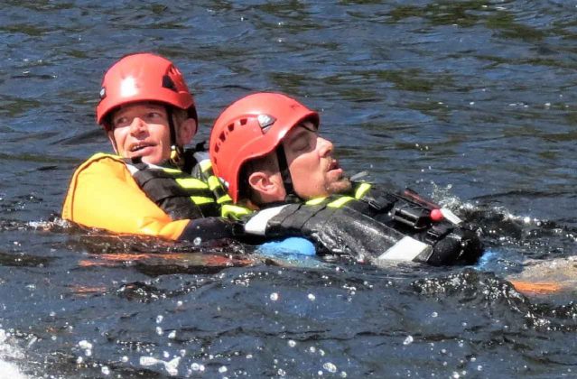 Warrant Officer Kevin Meikle,left, drags a "victim" to shore during white water rescue training. credit Sergeant Peter Moon